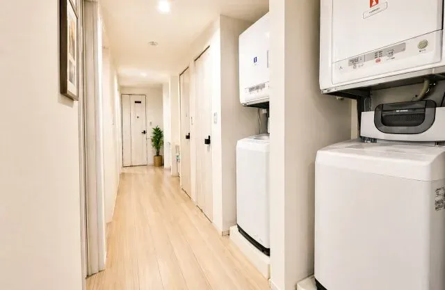 Furnished Tokyo apartment interior with washing machine and appliances ready on arrival